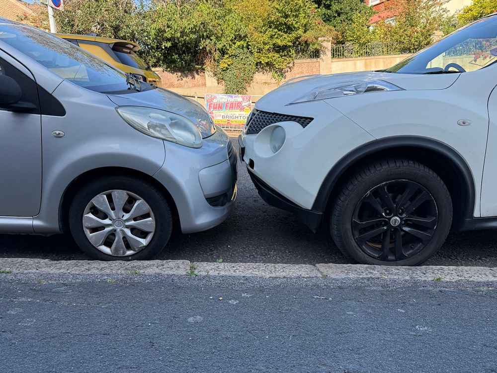 Photograph of RF12 JVH - a White Nissan Juke parked in Hollingdean by a non-resident who uses the local area as part of their Brighton commute. The nineteenth of twenty-five photographs supplied by the residents of Hollingdean.