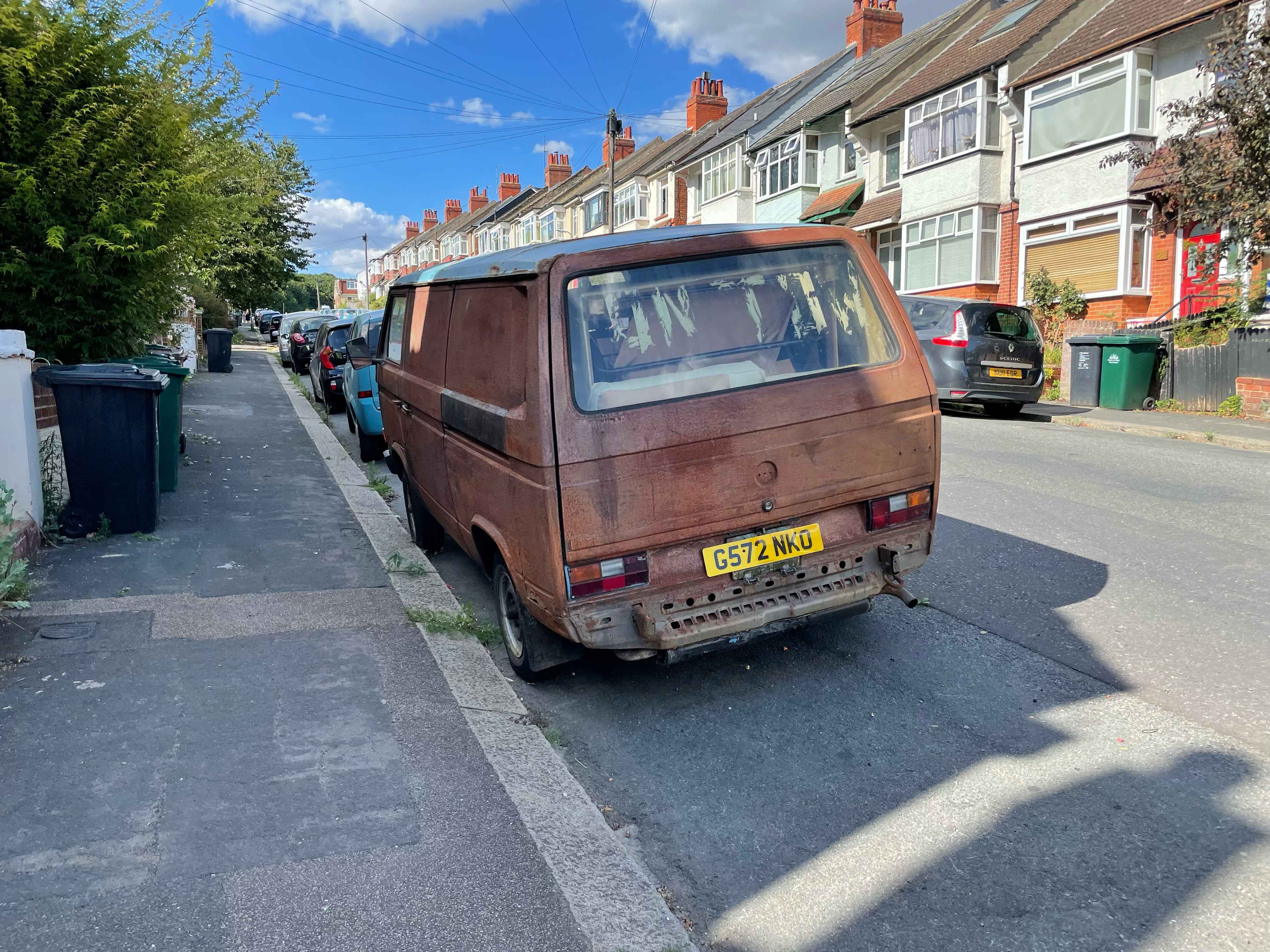 Photograph of G572 NKO - a Rusty Volkswagen Transporter camper van parked in Hollingdean by a non-resident. The second of two photographs supplied by the residents of Hollingdean.
