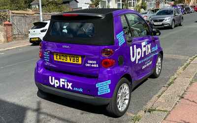 EA09 VBB, a Purple Smart Fortwo Cabriolet parked in Hollingdean