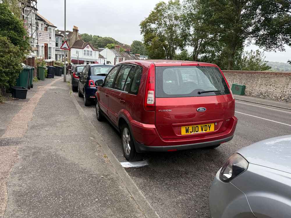 Photograph of WJ10 VDY - a Red Ford Fusion parked in Hollingdean by a non-resident. The fourth of five photographs supplied by the residents of Hollingdean.