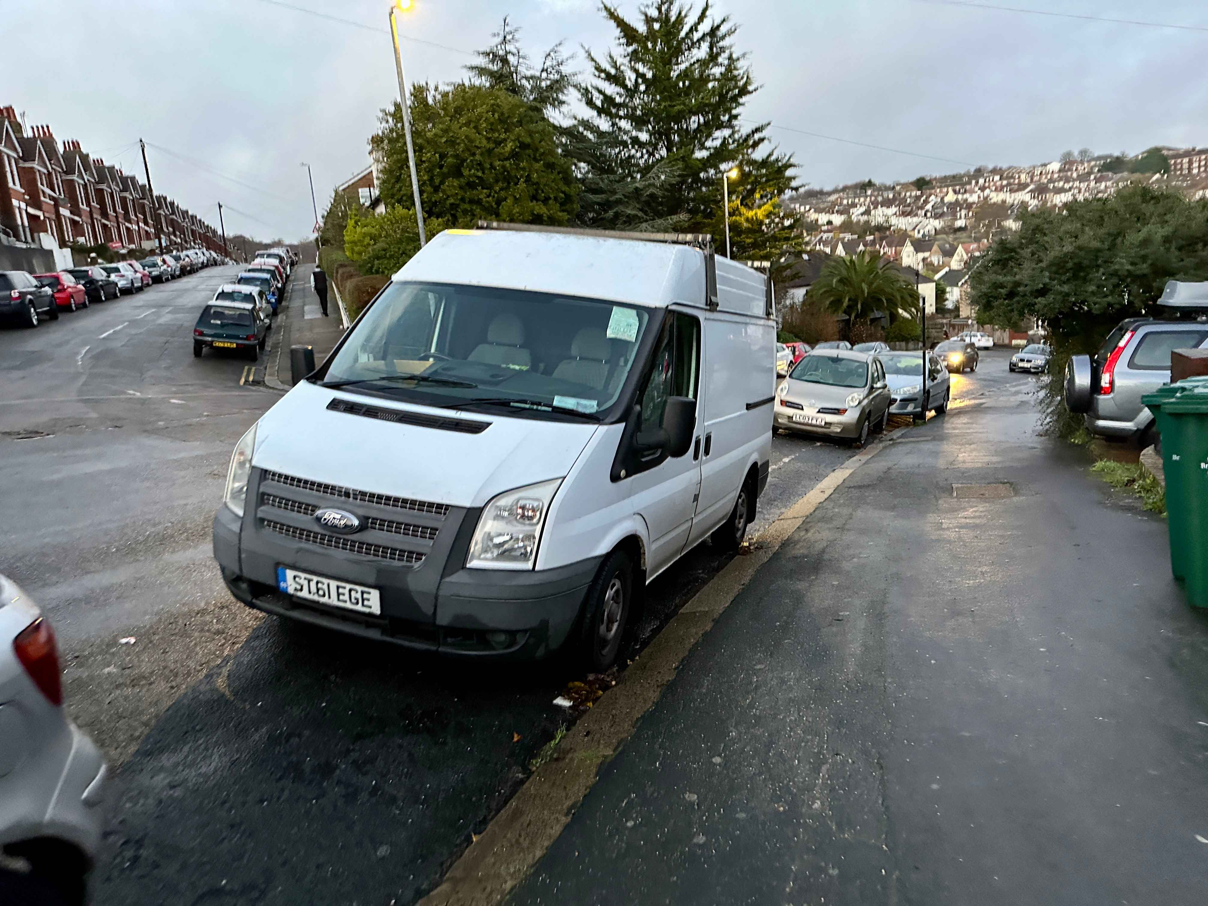 Photograph of ST61 EGE - a White Ford Transit parked in Hollingdean by a non-resident. The fourth of six photographs supplied by the residents of Hollingdean.