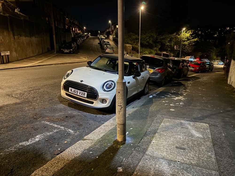 Photograph of NJ69 VXR - a Beige Mini Cooper parked in Hollingdean by a non-resident. The first of five photographs supplied by the residents of Hollingdean.