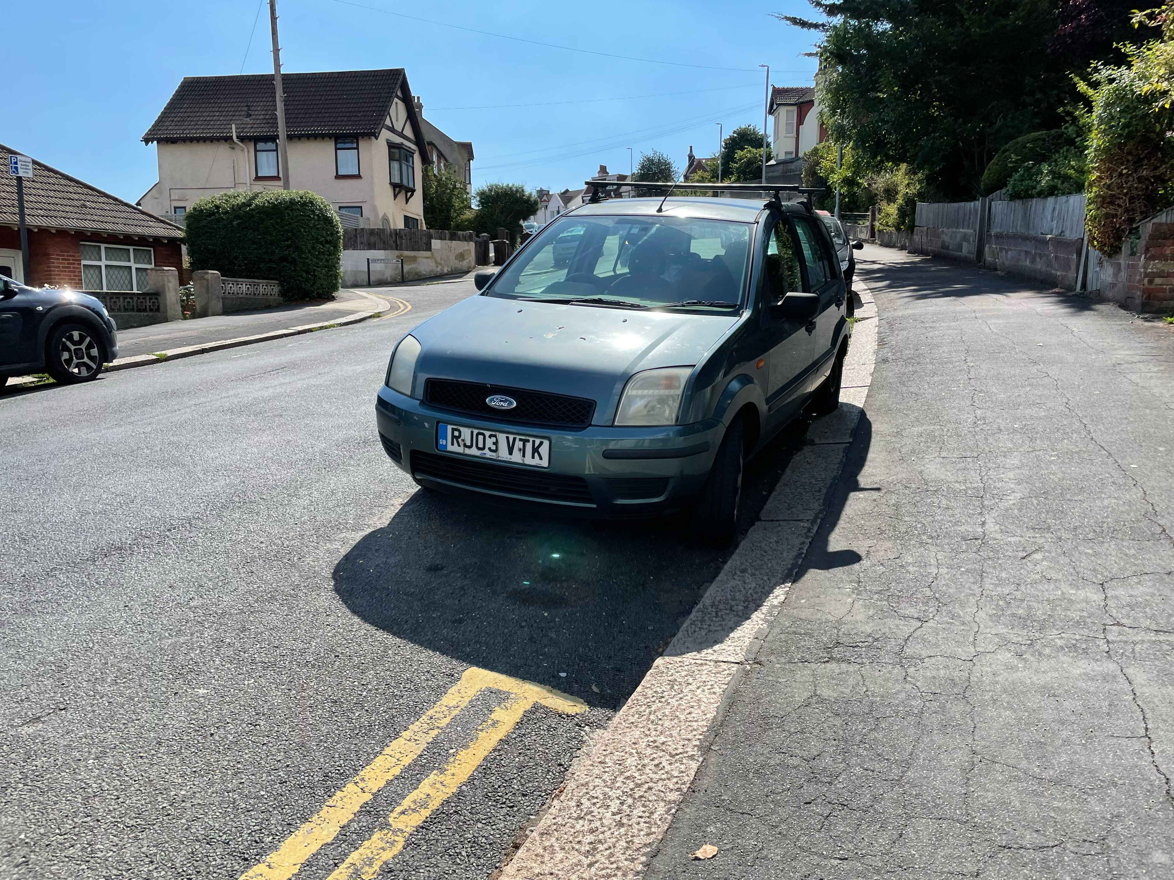 Photograph of RJ03 VTK - a Green Ford Fusion parked in Hollingdean by a non-resident. The first of five photographs supplied by the residents of Hollingdean.