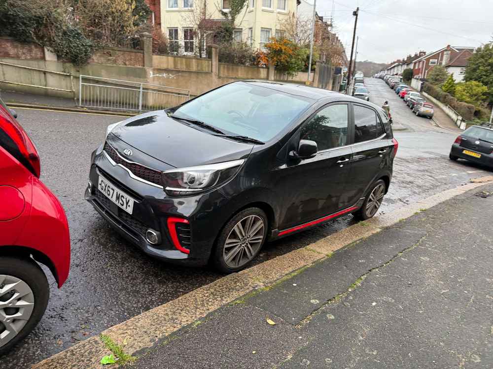 Photograph of GX67 MSY - a Black Kia Picanto parked in Hollingdean by a non-resident who uses the local area as part of their Brighton commute. The first of three photographs supplied by the residents of Hollingdean.
