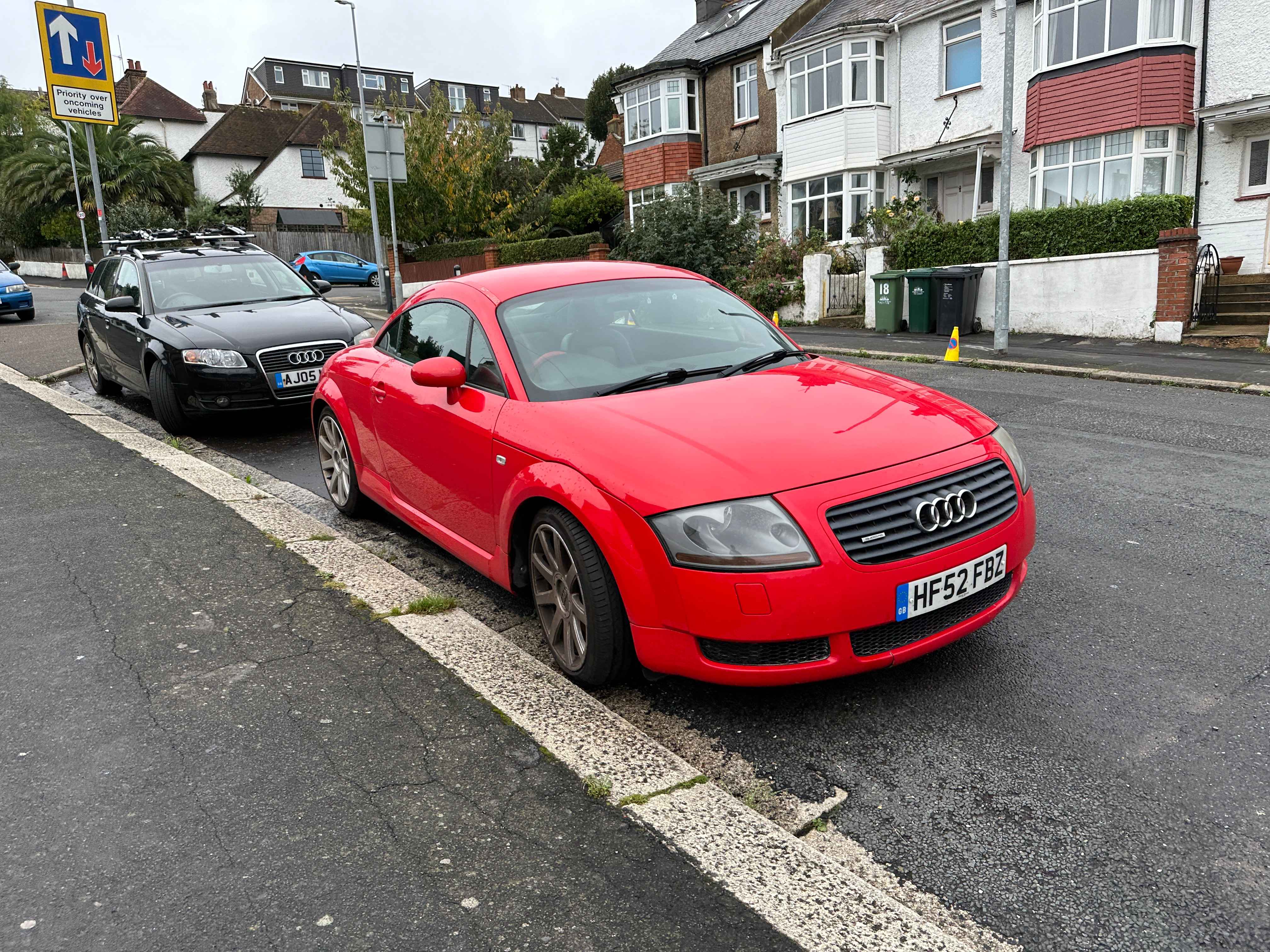 Photograph of HF52 FBZ - a Red Audi TT parked in Hollingdean by a non-resident, and potentially abandoned. The first of two photographs supplied by the residents of Hollingdean.
