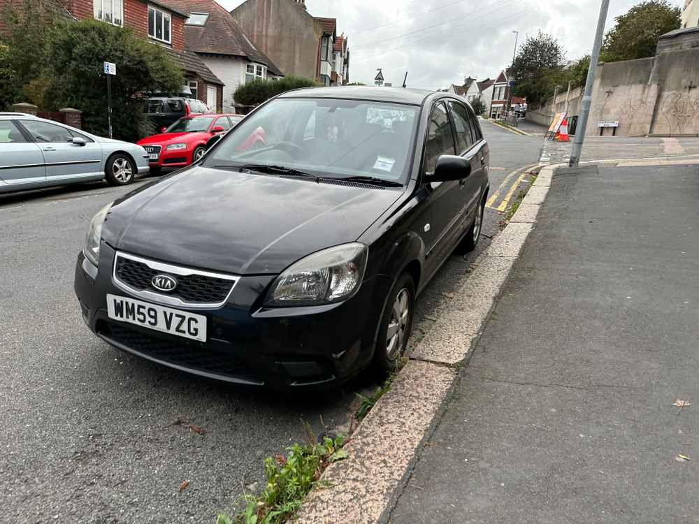 Photograph of WM59 VZG - a Black Kia Rio parked in Hollingdean by a non-resident. The third of eight photographs supplied by the residents of Hollingdean.