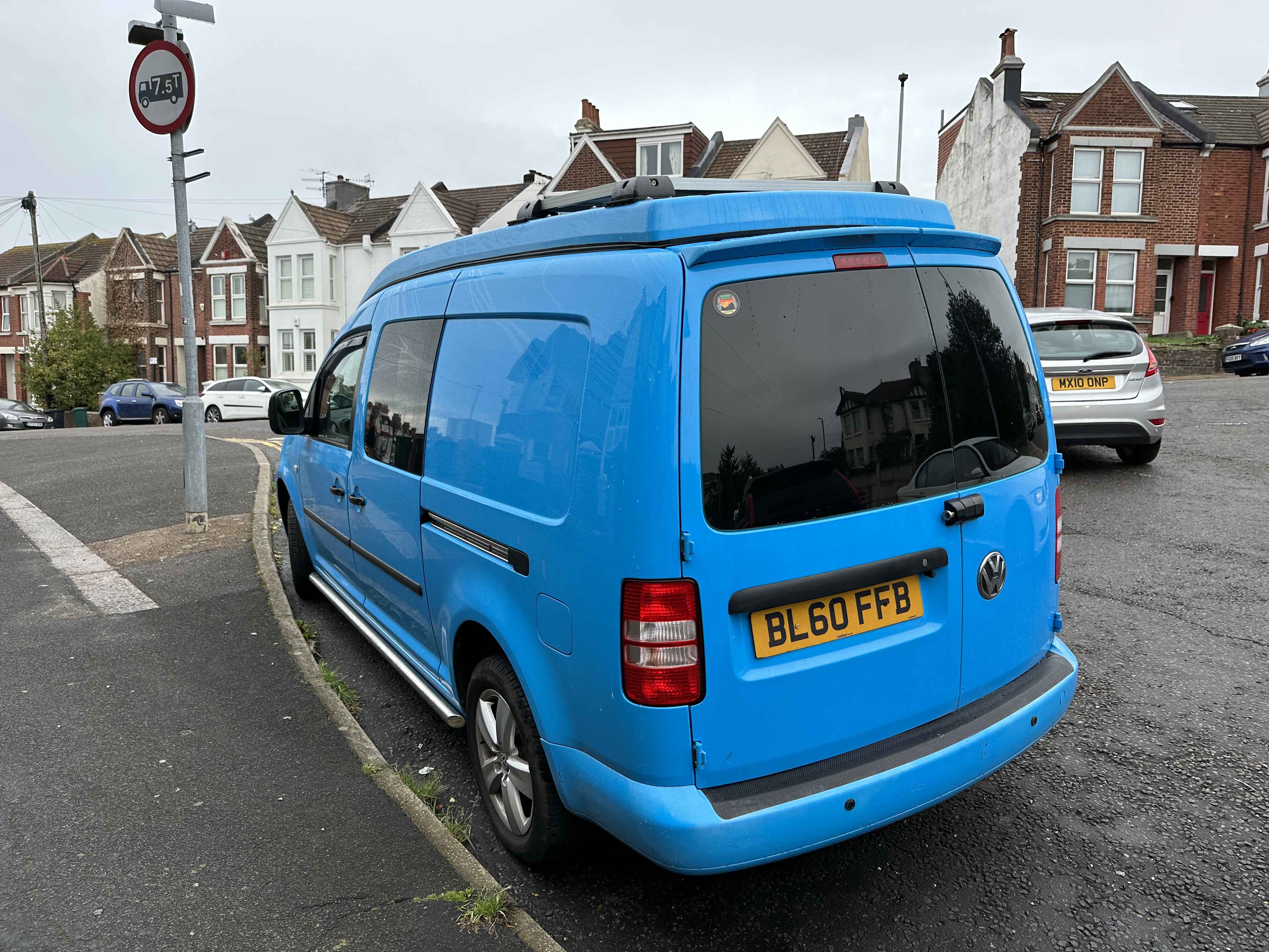 Photograph of BL60 FFB - a Blue Volkswagen Caddy Maxi parked in Hollingdean by a non-resident. 